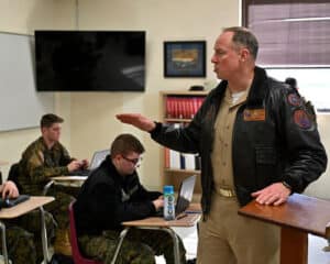 CAPT Mark Black interacting with cadets in classroom