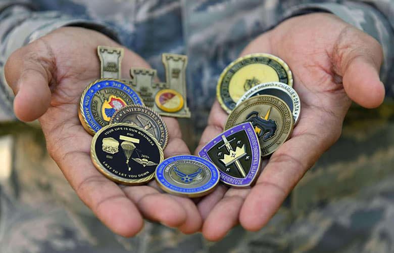 A US Air Force aircrew member displays his challenge coin collection.
Credit: Defense Visual Information Distribution Service